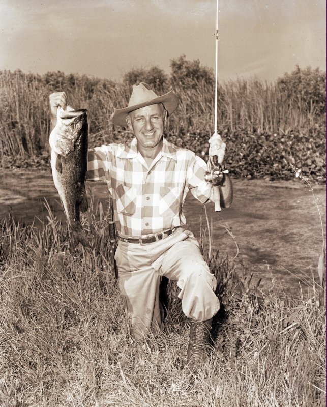 CCE 3-187 Charlie w large bass at Lake Okeechobee.jpg