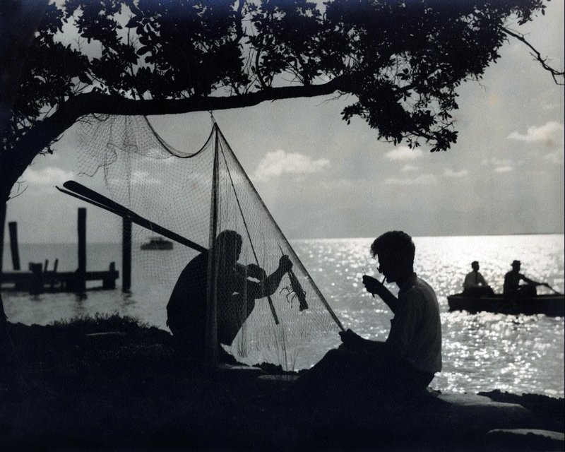 CENICS 8-30 silhouette of men mending lobster net hand colored by C. Ebbets c. 1926.wx.jpg
