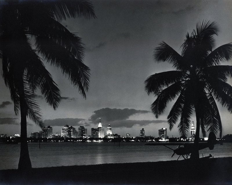 LANDSCAPES  SCENICS 8-37 Miami skyline at night w seaplane in foreground c. 1948..jpg