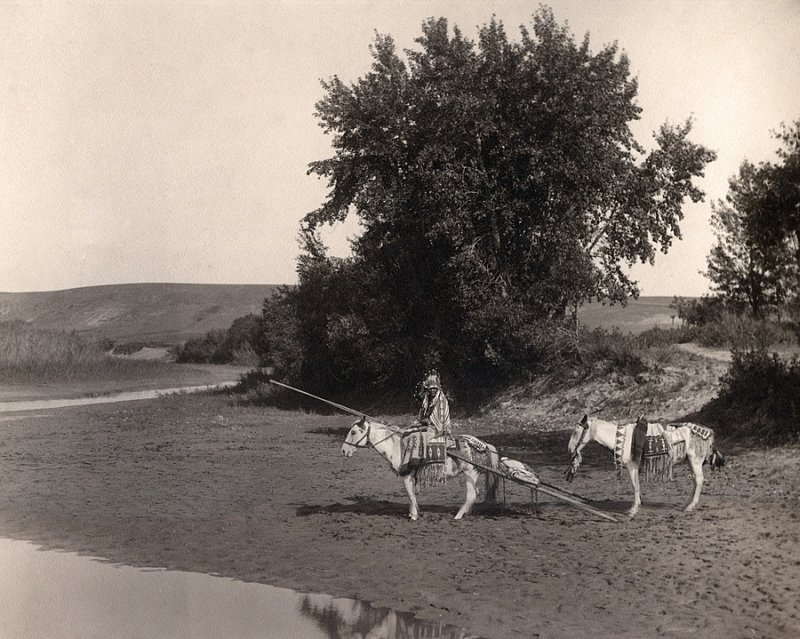 MISCELLANEOUS 9-21 Indian at river w travois C. 1929.jpg