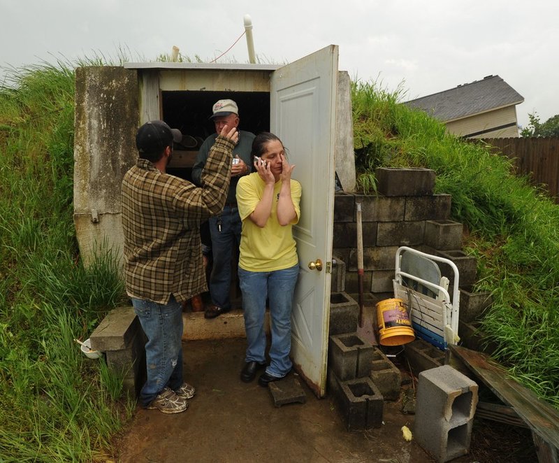 041127  ALA STORMS_003.jpg :: Residents of Pearson street in Fairview seek refuge in a tornado shelter as Alabama was hit hard by storms Wednesday April 27, 2011.      (The Birmingham News/ Hal Yeager)