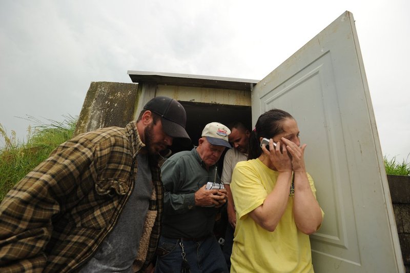 041127  ALA STORMS_004.jpg :: Residents of Pearson street in Fairview seek refuge in a tornado shelter as Alabama was hit hard by storms Wednesday April 27, 2011.      (The Birmingham News/ Hal Yeager)