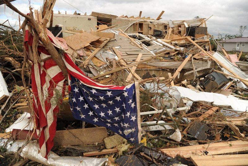 041128 ALABAMA TORNADOES.jpg :: An American flag is caught in a tree at a destroyed residence in Concord, Ala. Thursday April 28, 2011. (The Birmingham News/Hal Yeager)