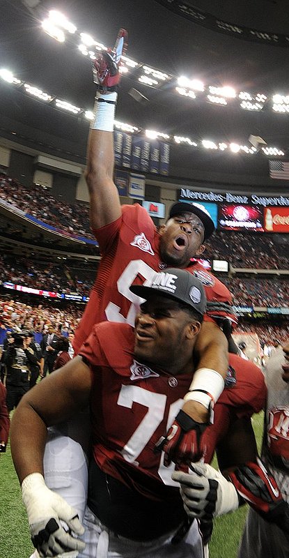 1129 LSU ALABAMA_009.jpg :: Alabama defensive lineman Brandon Lewis (95) and Alabama offensive lineman D.J. Fluker (76) celebrate after the game in the 2012 BCS National Championship game in the Mercedes-Benz Superdome Monday, January 9, 2012 in New Orleans, La. (Birmingham News, Hal Yeager)