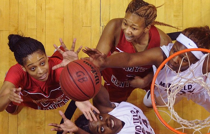 22512  MIDFIELD SUMTER CENTRAL_003.jpg :: Sumter Central's Haven Moore (00), Alfondria Brown (3), Midfield's LaToya Wilson (34) and Midfield's Dionnika Moore (21) battle for a rebound in an AHSAA Central Regional girls 4A final basketball game at the Dunn-Oliver Acadome, Saturday Feb. 25, 2012 in Montgomery, Ala. (The Birmingham News, Hal Yeager)