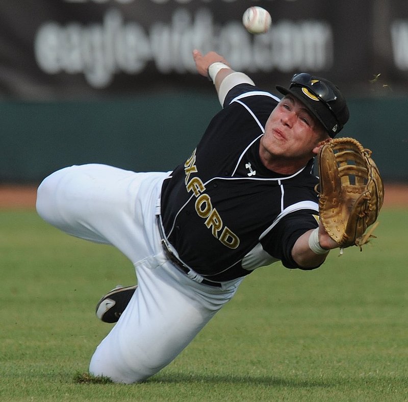 51112 OXFORD SPAIN PARK_002.jpg :: Oxford's Matthew Goodson dives but misses this fly ball in centerfield in a state regional playoff game at Spain Park high school Friday May 11, 2012 in Hoover, Ala. (The Birmingham News, Hal Yeager)