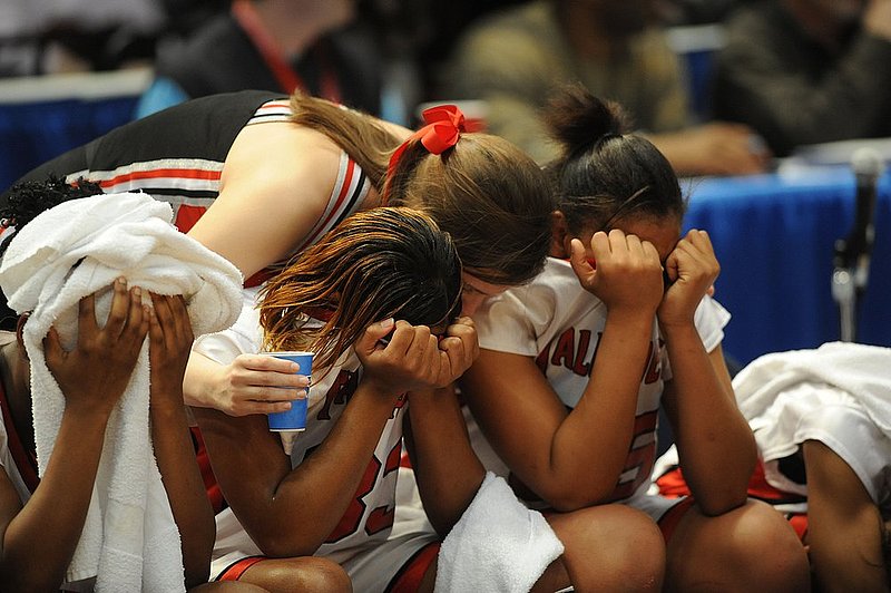 5A GIRLS TALLADEGA EUFAULA1.jpg :: Talladega cheerleader Mary Laura Kulovitz comforts two players after the end of the game in the girls class 5A state basketball championship final Friday, February 29, 2008. Eufaula wins 64-53. News staff/Hal Yeager reporter/Victory