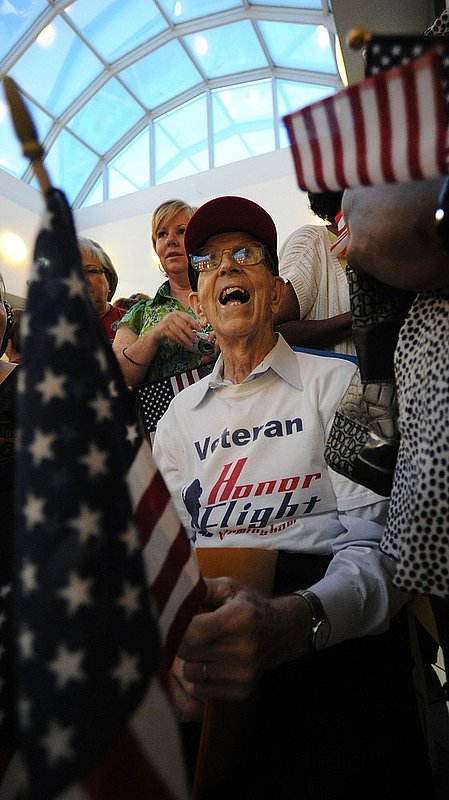 62112 HONOR FLIGHT.jpg :: Previous Honor Flight participant Billy Gamble , Pine Mountain, joins others as they greet participants of the last flight at Birmingham/Shuttlesworth International Airport Thursday June 21, 2012 in Birmingham, Ala. The program was begun five years ago to take veterans to Washington DC. (The Birmingham News,Hal Yeager)