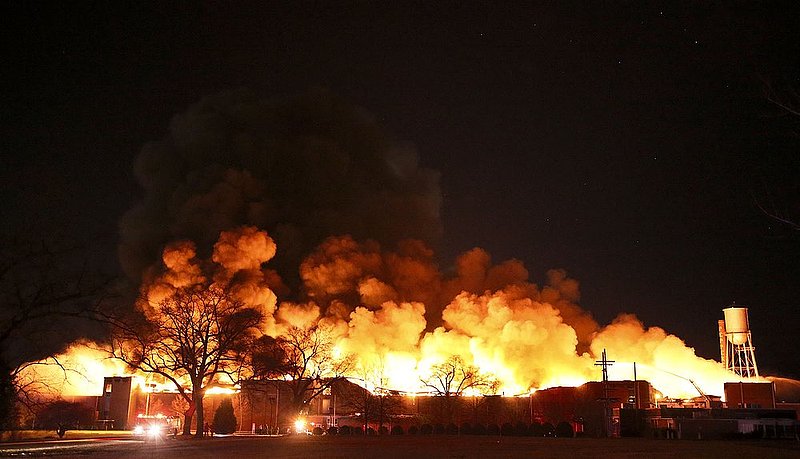 ALBIN102.jpg :: Firefighters work to extinguish a huge fire in the The vacant Pepperell Mill building in Opelika, Ala., Tuesday, March. 12, 2013. The mill is best known today, along with its surrounding mill village and the Golden Cherry Motel, as filming locations for the 1979 film Norma Rae. The entire building is fully involved. (AP Photo/Hal Yeager)