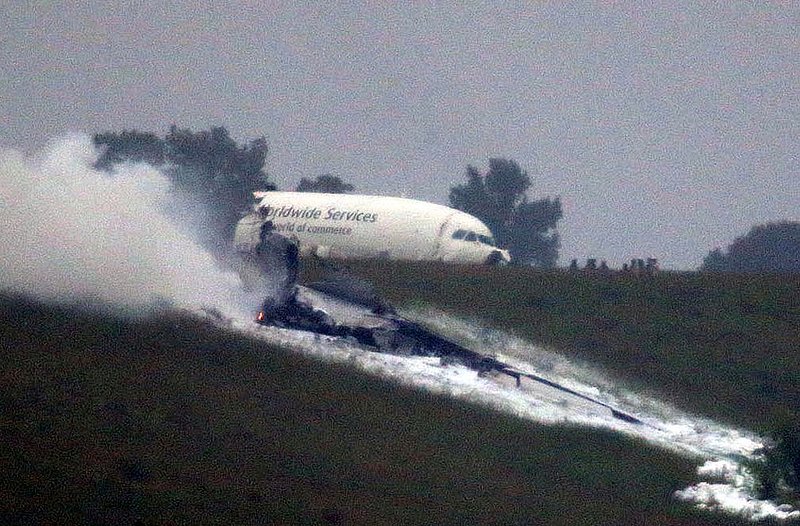 ALHY 102.jpg :: An A300 cargo plane lies on a hill at Birmingham Shuttlesworth International Airport after crashing on approach this morning Wednesday August 14,  2013 in Birmingham, Ala. (Photo/Hal Yeager)