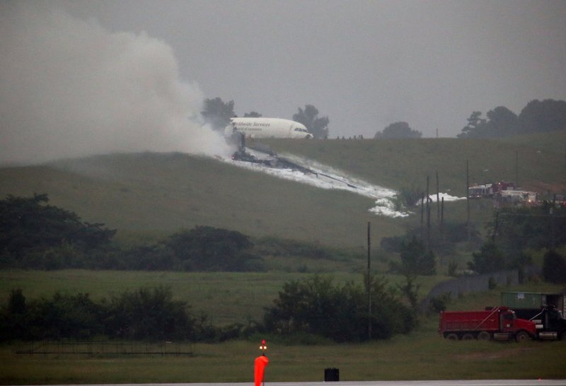 ALHY 103.jpg :: An A300 cargo plane lies on a hill at Birmingham Shuttlesworth International Airport after crashing on approach this morning Wednesday August 14,  2013 in Birmingham, Ala. (Photo/Hal Yeager)