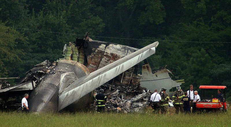 ALHY101.jpg :: NTSB investigators work around the tail section of the UPS cargo plane that crashed on approach to the Birmingham-Shuttlesworth International Airport August 15,  2013 in Birmingham, Ala. (Photo/Hal Yeager)