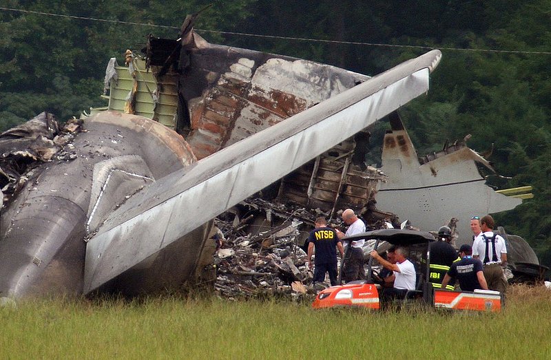 ALHY102  .jpg :: NTSB investigators work around the tail section of the UPS cargo plane that crashed on approach to the Birmingham-Shuttlesworth International Airport August 15,  2013 in Birmingham, Ala. (Photo/Hal Yeager)