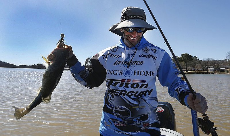 BASSMASTER Classic ALHY101A.jpg :: Springville Alabama's Randy Howell smiles as he lands a largemouth bass in the first day of the 3 day 44th
edition BASSMASTER Classic on Lake Guntersville Friday Feb. 21, 2014 in Guntersville, Ala. Fifty five professional anglers are competing for first prize winnings of $300,000. (AP Photo/Hal Yeager)