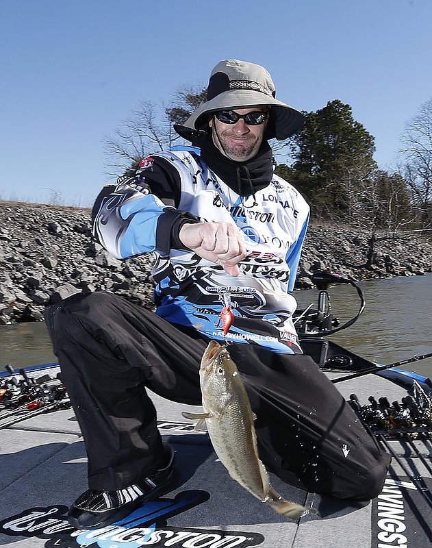 BASSMASTER Classic ALHY102 copy.jpg :: Springville Alabama's Randy Howell smiles as he lands a largemouth bass in the first day of the 3 day 44th
edition BASSMASTER Classic on Lake Guntersville Friday Feb. 21, 2014 in Guntersville, Ala. Fifty five professional anglers are competing for first prize winnings of $300,000. (AP Photo/Hal Yeager)