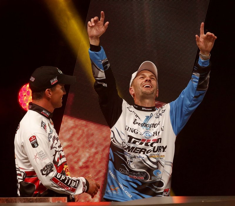Bassmaster Classic ALHY105.jpg :: Angler Edwin Evers, Talala, Ok., watches as Randy Howell, Springville, Ala., reacts to learning that he has won the Bassmasters Classic at the weigh-in Sunday Feb. 23, 2014 in Birmingham, Ala.(Photo/Hal Yeager)
