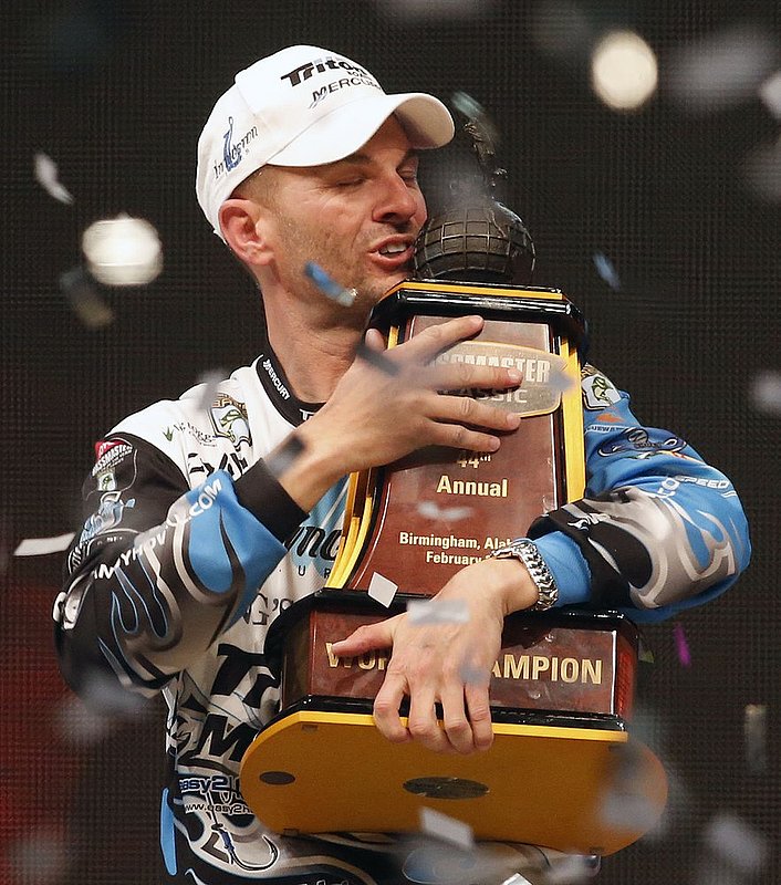 Bassmaster Classic ALHY107.jpg ::  Randy Howell, Springville, Ala., hugs the championship trophy after winning the Bassmasters Classic Sunday Feb. 23, 2014 in Birmingham, Ala.(Photo/Hal Yeager)