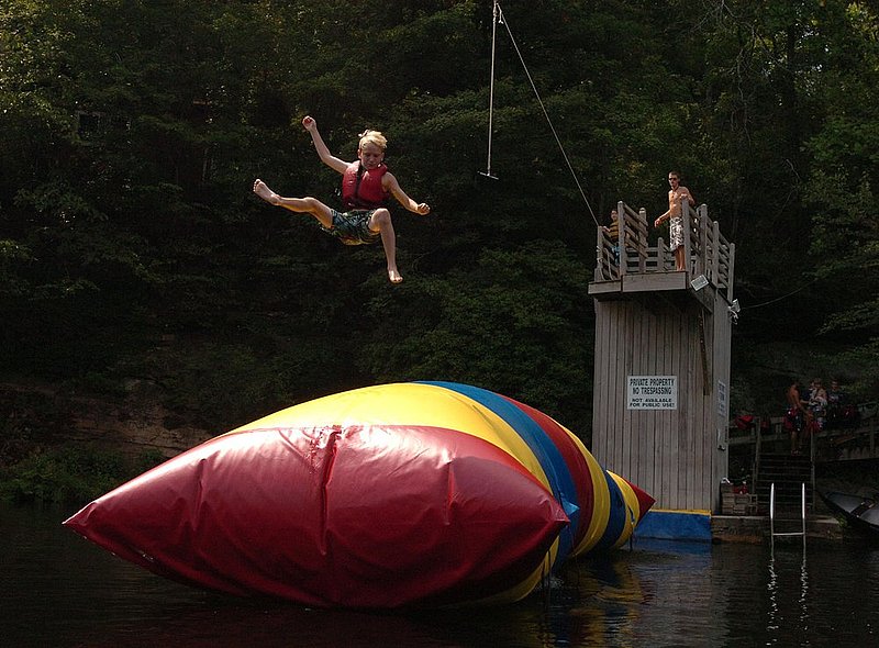 CAMPS1.jpg :: CAMPS----Northeast Alabama is well know for it's boys and girls summer camps. Kids come from all over the nation to attend the camps mostly situated along Little River. Wilson Benton, Hattiesburg, MS.is launched off the blob on Little River at Camp Alpine for boys near Mentone.  News staff/Hal Yeager  reporter/Spencer