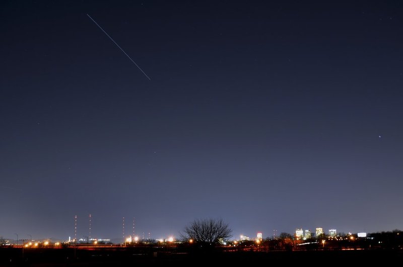 ISS.jpg :: Approximately 220 miles above the Red Mountain TV  towers, Vulcan and the downtown skyline the International Space Station produces a streak of light in this 30 second time exposure as it appears in the darkening sky over downtown Birmingham. The station appeared for a 3 minute view starting Wednesday at 6:33 PM local time. Sighting opportunities are listed on www.spaceflight.nasa.gov/realdata/sightings/index.html.   Birmingham will have views of the station until January 19 (Birmingham News/Hal Yeager)