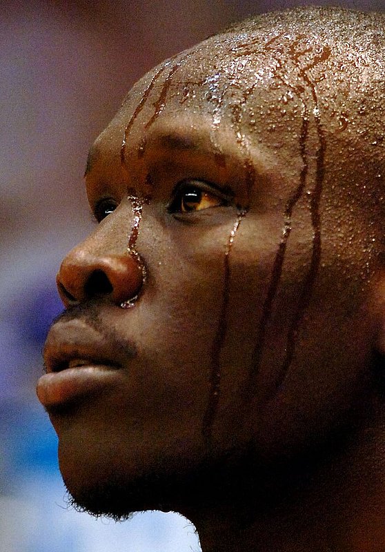 TENNESSEE BUTLER.jpg :: TENNESSEE BUTLER-----NCAA second round regional Louisville vs Oklahoma. Louisville wins 78-48. Oklahoma's #30 longar Longar sweats as he comes to the bench to take a breather. News staff/Hal Yeager