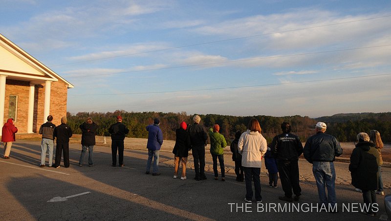 WHOOPING CRANES    148.jpg :: About 25 people gathered at the Parrish Church of the Nazarene to watch as lead pilot Joe Duff in his ultralight aircraft made a fly over with 10 juvenile Whooping Cranes following as part of Operation Migration on their journey from Wisconsin to their wintering habitats at Chassahowitzka and St. Marks National Wildlife Refuges along Florida's Gulf Coast. This is the 10th group of birds to take part in a landmark project led by the Whooping Crane Eastern Partnership, an international coalition of public and private groups that is reintroducing this highly imperiled species in eastern North America.  There are now about 106 whooping cranes in the wild in eastern North America thanks to their efforts.(The Birmingham News, Hal Yeager)