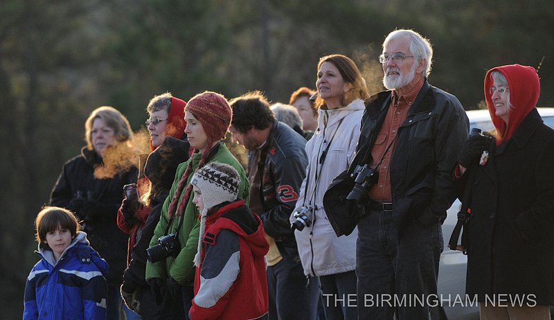 WHOOPING CRANES    165.jpg :: About 25 people gathered at the Parrish Church of the Nazarene to watch as lead pilot Joe Duff in his ultralight aircraft made a fly over with 10 juvenile Whooping Cranes following as part of Operation Migration on their journey from Wisconsin to their wintering habitats at Chassahowitzka and St. Marks National Wildlife Refuges along Florida's Gulf Coast. This is the 10th group of birds to take part in a landmark project led by the Whooping Crane Eastern Partnership, an international coalition of public and private groups that is reintroducing this highly imperiled species in eastern North America.  There are now about 106 whooping cranes in the wild in eastern North America thanks to their efforts.(The Birmingham News, Hal Yeager)