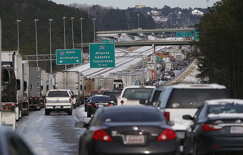 WINTER WEATHER ALHY101A.jpg :: Traffic is at a standstill on Interstate 65 northbound as officials work to clear abandoned vehicles Wednesday January 29,  2014 in Pelham,  Ala.  (AP Photo/Hal Yeager)