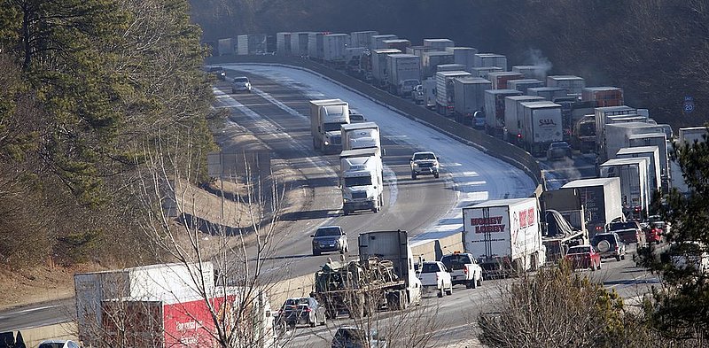 WINTER WEATHER ALHY103                    .jpg :: Vehicles are backed up on interstate 20 westbound Thursday January 30, 2014 in Leeds, Ala. Hundreds of vehicles still litter the roadways and with temperatures well below the freeing mark icy conditions still exist. and travel is being discouraged by officials. (AP Photo/Hal Yeager)