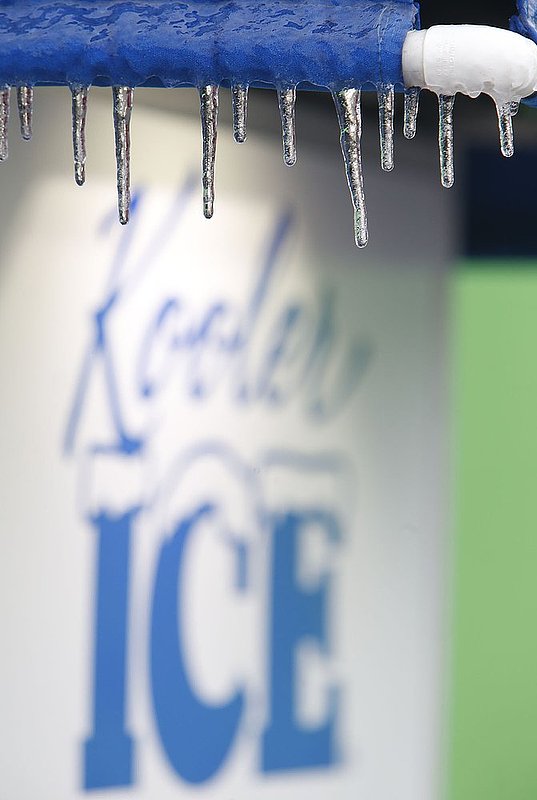 WINTER WEATHER ALHY104 9.53.42 PM1.jpg :: Ice sickles hangs from an ice machine Wednesday Feb. 12,  2014 in Fort Payne Ala. Officials are warning of ice and snow accumulations as the day continues. (AP Photo/Hal Yeager)