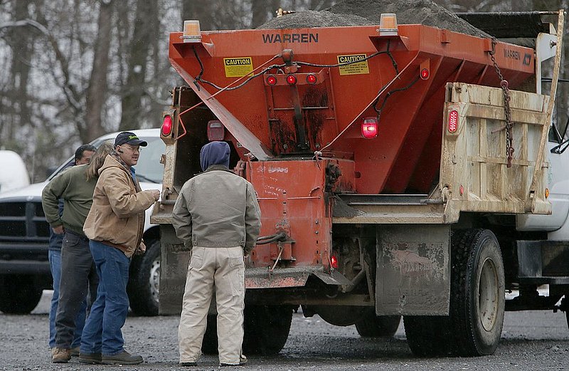 WINTER WEATHER ALHY105 9.53.42 PM.jpg :: Fort Payne public works employees prepare to put sand on icy roads atop Lookout Mountain Wednesday Feb. 12,  2014 in Fort Payne Ala. Officials are warning of ice and snow accumulations as the day continues. (AP Photo/Hal Yeager)