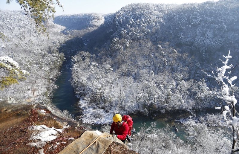 WINTER WEATHER ALHY109A.jpg :: Israel Partridge of True Adventure Sports prepare to rappel into a snow and ice covered Little River Canyon Thursday, Feb. 13,  2014 near Fort Payne Ala. A snow storm covered much of central and north Alabama Wednesday night with several inches of snow.  (AP Photo/Hal Yeager)
