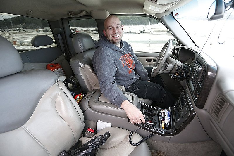 WINTER WEATHER ALHY110A.jpg :: Finally free after 20 hours Josh Weldon smiles as he tells about spending the night in his vehicle on interstate 65 Wednesday January 29,  2014 in Hoover,  Ala.  (AP Photo/Hal Yeager)