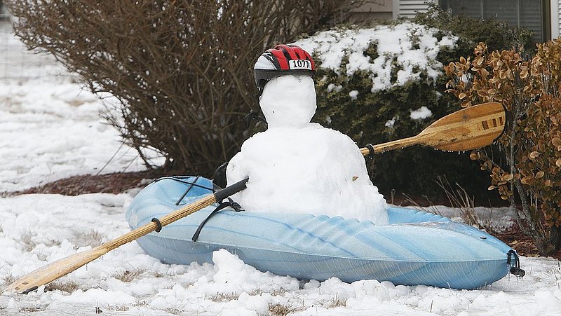 WINTER WEATHER ALHY111 9.53.42 PM.jpg :: A kayak snowman  is seen in the front yard of a house on highway 35  Wednesday Feb. 12,  2014 in Fort Payne Ala.  Officials are warning of ice and snow accumulations as the day continues. (AP Photo/Hal Yeager)