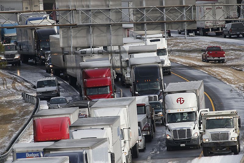 WINTER WEATHER ALHY122               .jpg :: Traffic is at a standstill on Interstate 20 westbound as officials work to clear abandoned vehicles Wednesday January 29,  2014 in Leeds,  Ala.  (AP Photo/Hal Yeager)