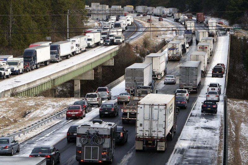 WINTER WEATHER ALHY124               .jpg :: Traffic is at a standstill on Interstate 20 eastbound as officials work to clear abandoned vehicles Wednesday January 29,  2014 in Leeds,  Ala.  (AP Photo/Hal Yeager)