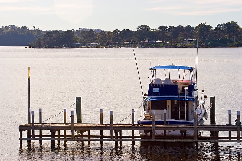 Australia 121.jpg :: A fishing boat tied to a pier in the Lakes Entrance, NSW, Australia