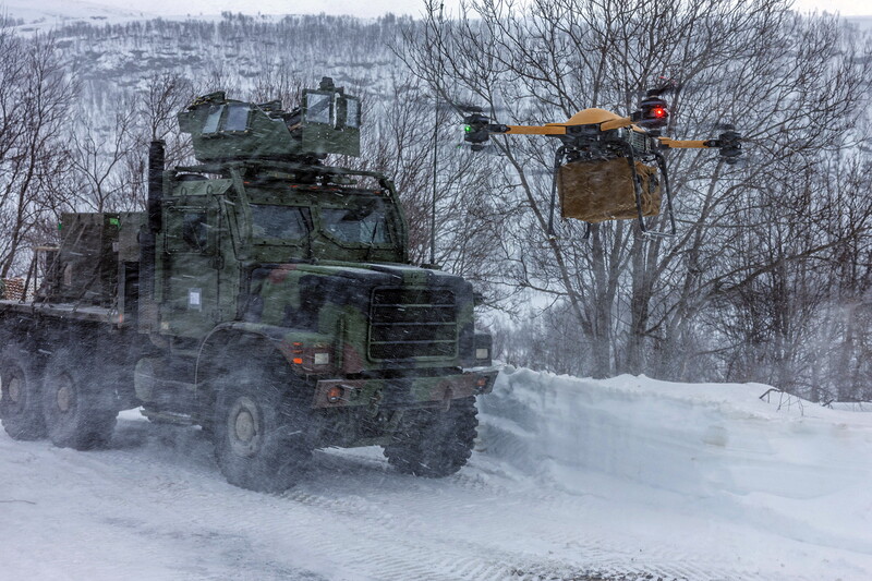 2nd Marine Logistics Group - M26139E.jpg :: 2nd Marine Logistics Group, Post-Vietnam War - US MARINES PHOTO: U.S. Marines with Combat Logistics Battalion 6, Combat Logistics Regiment 2, 2nd Marine Logistics Group, use a tactical resupply unmanned aircraft system to conduct a resupply during Exercise Nordic Response 24 in Alta, Norway, 12 Mar 2024. Exercise Nordic Response 24 is designed to enhance military capabilities and allied cooperation in high-intensity warfighting scenarios under challenging arctic conditions, while providing U.S. Marines unique opportunities to train alongside NATO allies and partners. (U.S. Marine Corps photo by Lance Cpl. Christian Salazar)
