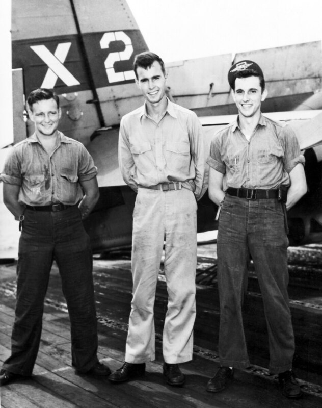 George W Bush (Pilot) - D23242E.jpg :: Bush, George W., Pilot, WW II - US NAVY PHOTO: A file photo taken 2 Nov 1944 of Navy pilot Lt. j.g. George H. W. Bush, center, with X-2 flight crew, radioman Joe Reichert, left, and turret gunner Leo W. Nadeau.