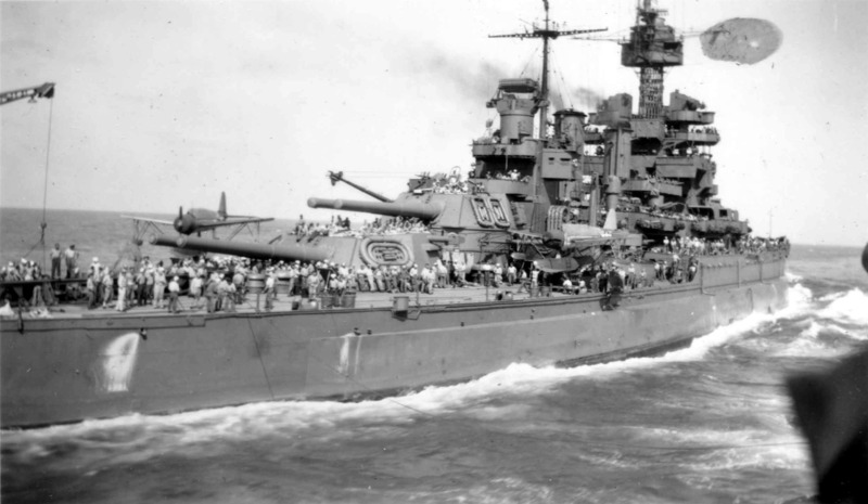 USS Colorado (BB-45) - N3160M.jpg :: USS Colorado (BB-45), Battleship, WW II - US NAVY PHOTO: Transfer of some sort between the USS Colorado (BB-45) and an unidentified ship alongside sometime after Oct 1944. Looks like they are preparing to refuel/resupply for the the ship from which the photo was taken. Note the crowd on the starboard side and the messanger line between the two ships. The Aircraft have probably been shifted off the catapult to provide more deck space and to clear the radius of action for the stern crane. Although it might be the other way round as BB's often served as tankers/luxury stores (i.e. Ice cream) for their escorting DDs.