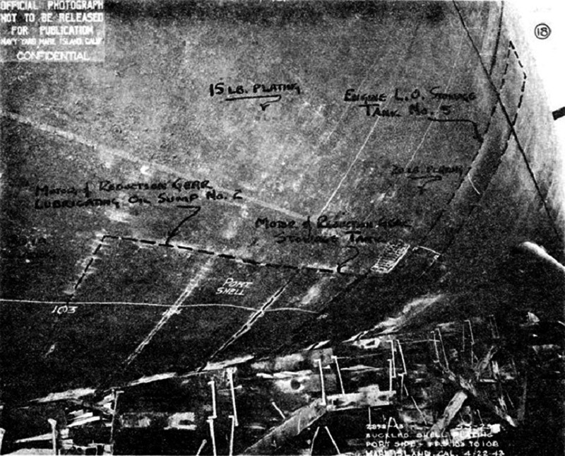 USS Kingfish (SS-234) - N9376H.jpg :: USS Kingfish (SS-234), Submarine - Attack-Fleet, WW II - US NAVY PHOTO: View of USS Kingfish (SS-234) showing depressions in port side shell plating from frames 103-108 near lubricating oil tanks. Damage was caused by depth charge explosions on 24 Mar 1943 off Formosa, with the starboard side of the boat similarly damaged.