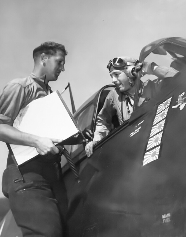 USS Langley (CVL-27) - N623G.jpg :: USS Langley (CVL-27), Light Aircraft Carrier, WW II - US NAVY PHOTO: Commander Edward C. Outlaw, USN, in his F6F-3 Hellcat, aboard USS Langley (CVL-27), receiving a send off from his plane from AMM3/C H.T. Sliper, USN, 29 Apr 1944.
