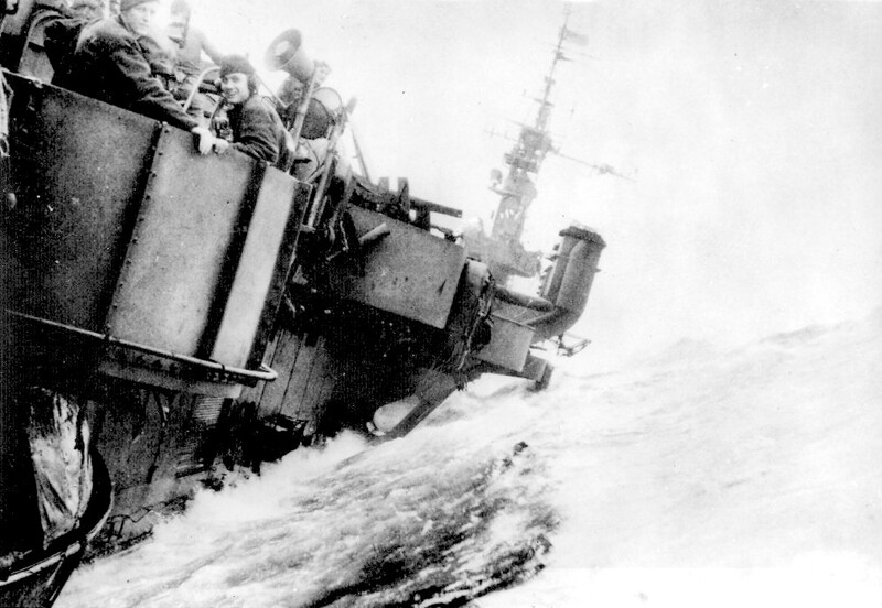 USS Langley (CVL-27) - N625J.jpg :: USS Langley (CVL-27), Light Aircraft Carrier, WW II - US NAVY PHOTO: Sailors seen manning anti-aircraft gun tubs on USS Langley (CVL-27). The ship is steaming through a typhoon heavy seas in Jun 1945.