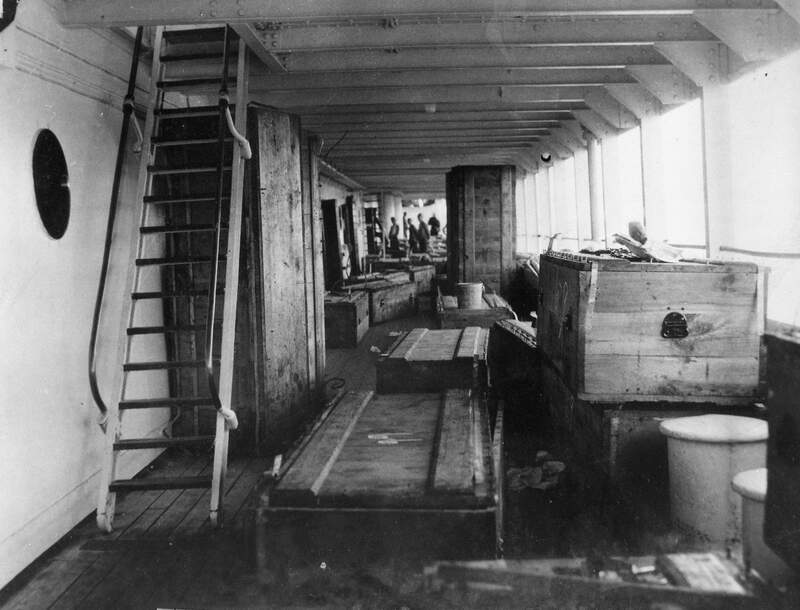 USS Mississippi (BB-41) - N3117A.jpg :: USS Mississippi (BB-41), Battleship, Post-WW I - US NAVY PHOTO: USS Relief (AH-1) preparing caskets for the dead USS Mississippi (BB-41) and USS New Mexico (BB-40) crew members on 13 Jun 1924.