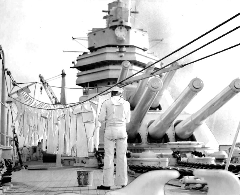 USS Mississippi (BB-41) - N3118H.jpg :: USS Mississippi (BB-41), Battleship, Post-WW I - US NAVY PHOTO: The USS Mississippi's (BB-41) here and they're hangin' out de clo'es, 6 Sep 1934. The 30,000-ton battleship tied up at the Navy Yard for a five-day visit, having been completely modernized at Norfolk and placed in commission early this year. One of the crew is shown hanging out the 'whites,' which are a little hard to keep as clean as Uncle Sam demands.\