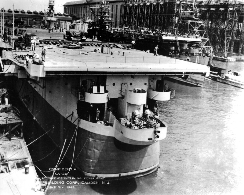 USS Monterey (CVL-26) - N611G.jpg :: USS Monterey (CVL-26), Light Aircraft Carrier, WW II - US NAVY PHOTO: New York Shipbuilding Corp., Camden, N.J. (5 Jun 1943) - VAthwartship track is seen on deck of the USS Monterey (CV-26) for shifting weights during the inclining experiment. Inclining experiment is a test performed on a ship to determine its stability, lightship weight and the coordinates of its center of gravity. The test is applied to newly constructed ships greater than 24m in length, and to ships altered in ways that could affect stability. Inclining test procedures are specified by the International Maritime Organization and other international associations. As you can see by her hull she was originally built as a Cleveland-class light cruiser but redesignated for completion as an aircraft carrier. She was commissioned twelve days later on 17 Jun 1943.