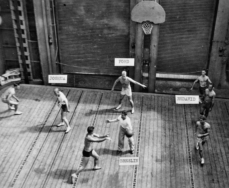 USS Monterey (CVL-26) - N612G.jpg :: USS Monterey (CVL-26), Light Aircraft Carrier, WW II - US NAVY PHOTO: This photograph depicts [future president] Gerald Ford and other players during a basketball game. The photograph was taken aboard the United States Navy aircraft carrier USS Monterey (CVL-26), on which Lieutenant Commander Ford served as Athletic Director. It had been Ford's idea to create a basketball court on the forward elevator of the ship. Labels identify some of the players, 1944.
