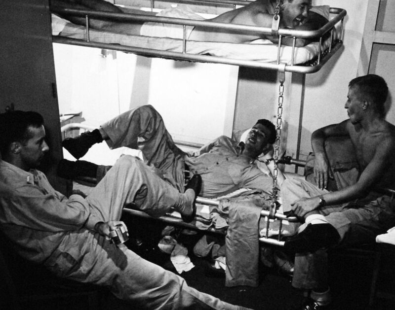 USS Monterey (CVL-26) - N613B.jpg :: USS Monterey (CVL-26), Light Aircraft Carrier, WW II - US NAVY PHOTO: TBM Pilots of Torpedo Squadron (VT) 28, Light Carrier Air Group (CVLG) 28, USS Monterey (CVL-26), in a bull-session between strikes on Guam. Photographed by Lieutenant Victor Jorgensen, Jul 1944.