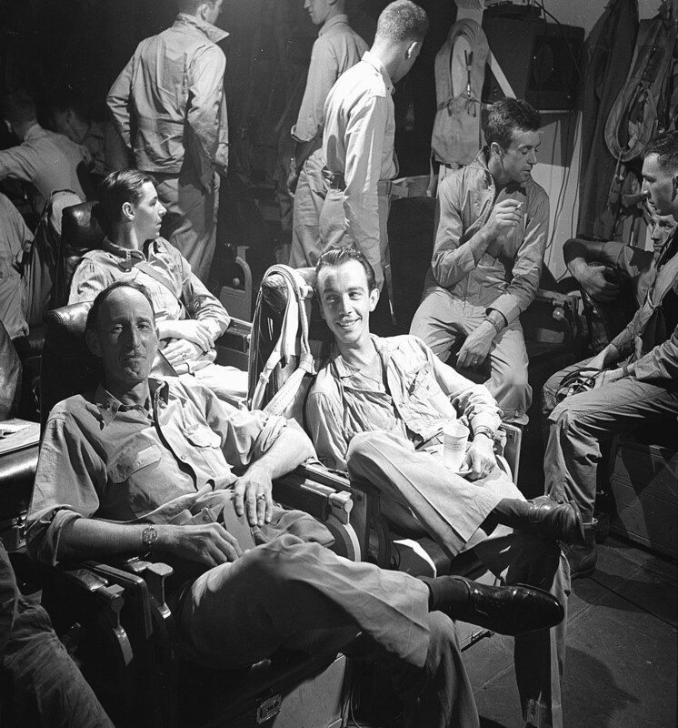 USS Monterey (CVL-26) - N613M.jpg :: USS Monterey (CVL-26), Light Aircraft Carrier, WW II - US NAVY PHOTO: CAPT Stuart H. Ingersoll, C.O. of a U.S. Navy carrier USS Monterey (CVL-26), smiles in complete relaxation as the pilots report over the inter-plane system that their mission is completed and that the bombers are on their way home, Dec 1944.