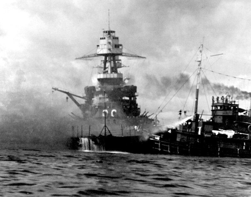 USS Nevada (BB-36) - N3061E.jpg :: USS Nevada (BB-36), Battleship, WW II - US NAVY PHOTO: USS Nevada (BB-36) aground and burning off Waipio Point, after the end of the Japanese air raid. Ships assisting her, at right, are the harbor tug Hoga (YT-146), 7 Dec 1941.