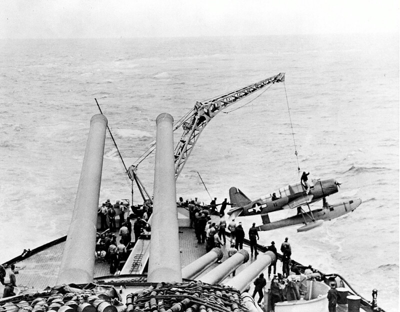 USS Nevada (BB-36) - N3063J.jpg :: USS Nevada (BB-36), Battleship, WW II - US NAVY PHOTO: OS2U Kingfisher being hoisted aboard the USS Nevada (BB-36) circa 1944-1945.

